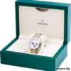 Green Rolex display box with gold crown logo and watch inside